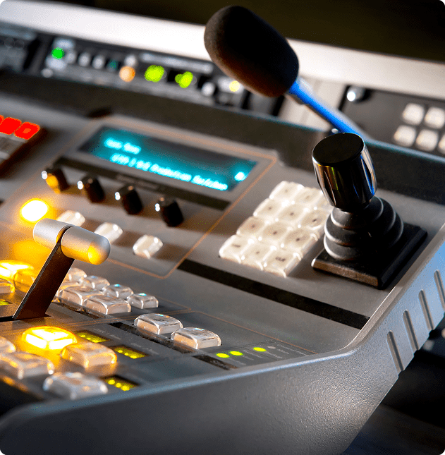 Broadcast control panel with microphone.