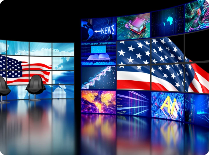 News studio with American flag and screens.